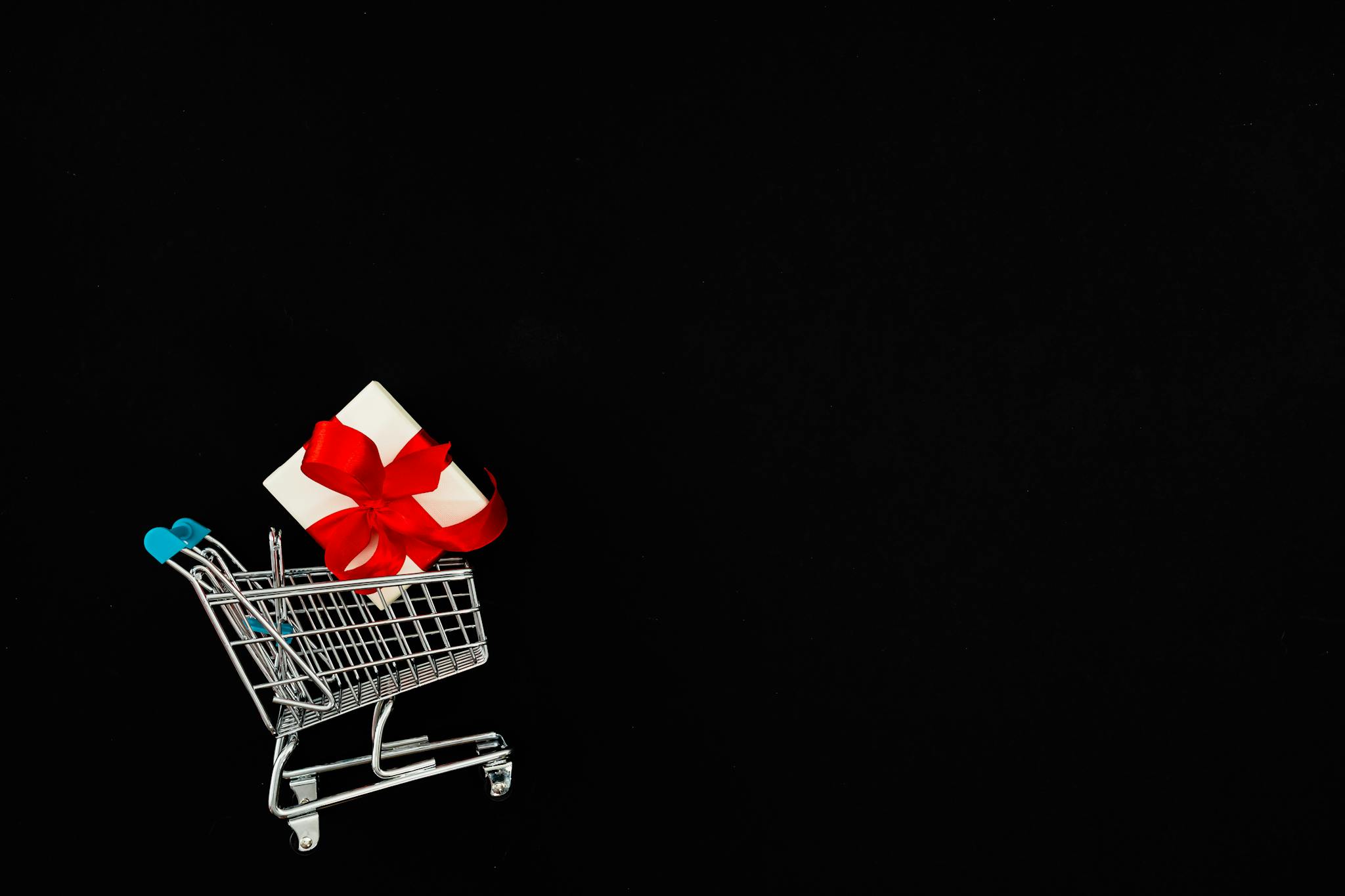 About 2 present in a mini shopping cart