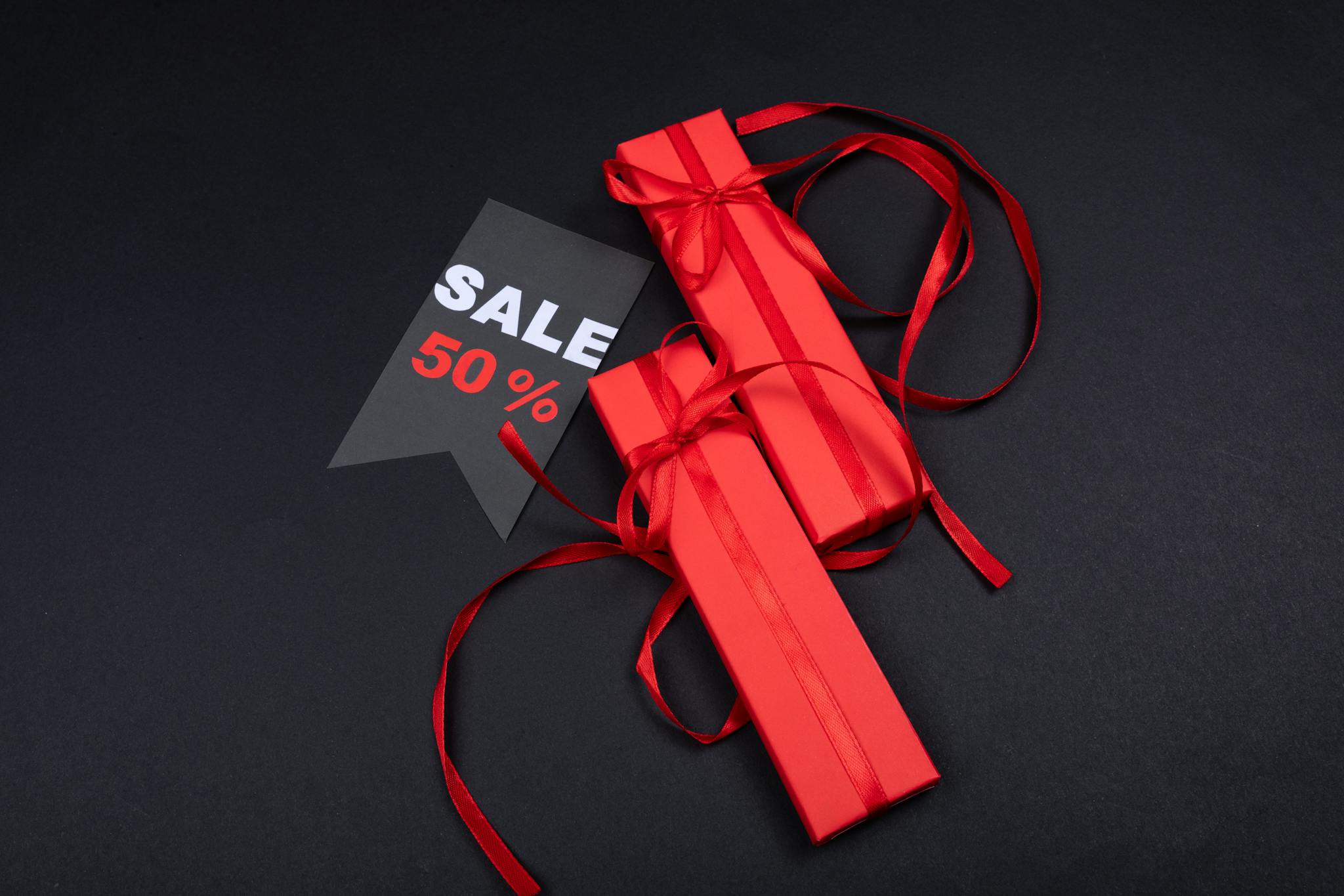 About 6 red gifts with red ribbons